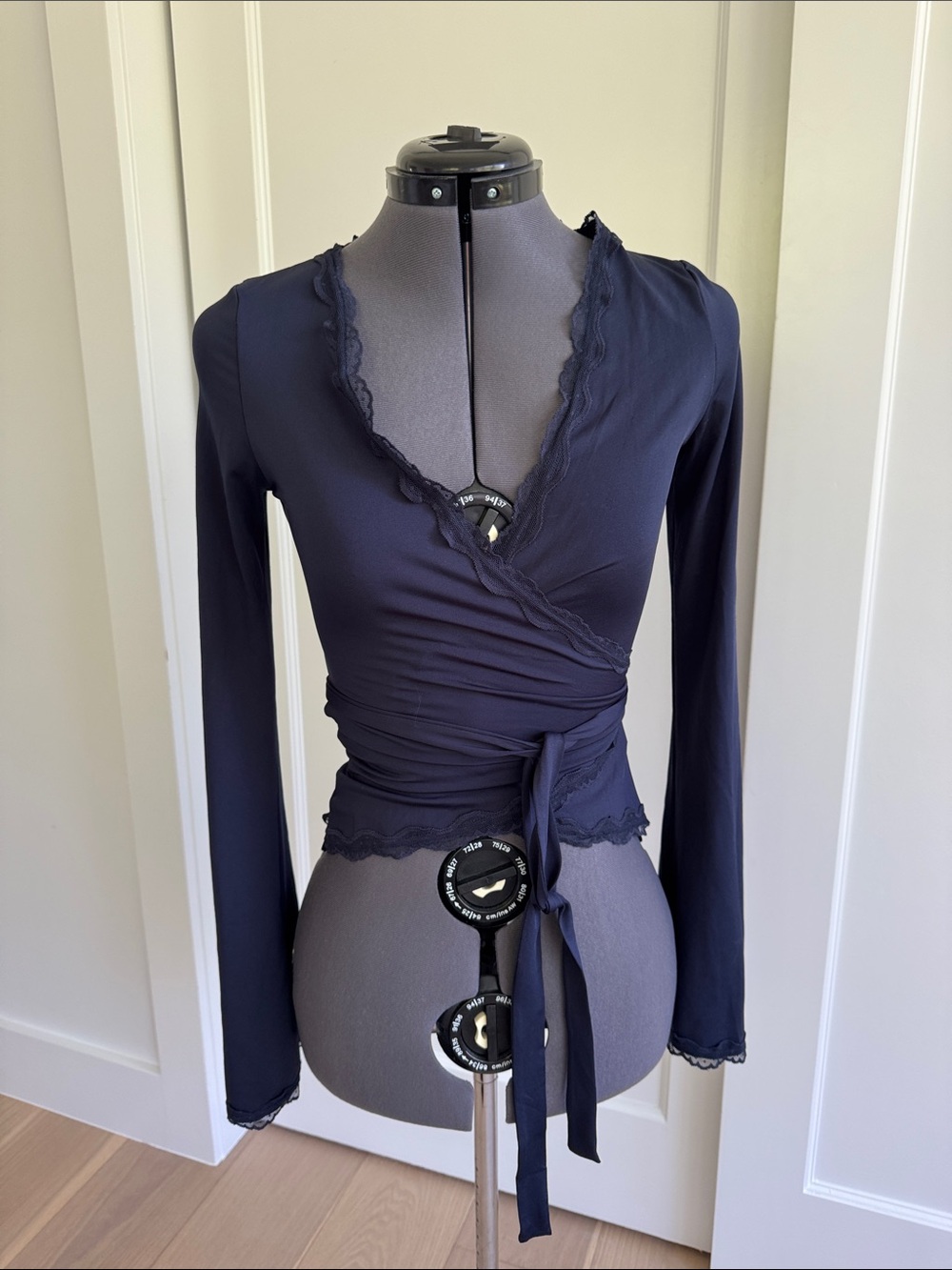 Wrap-Front Long Sleeve Top in Navy with Lace Trim